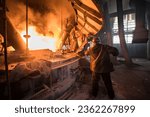 Steelworker at work near the arc furnace