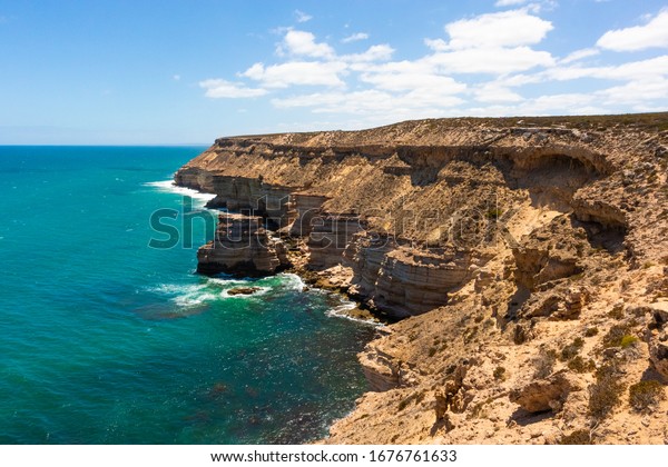 Steep\
cliff by the sea. Limestone rocks. Turquoise color. Kalbarri\
national park, Western Australia WA,\
Australia