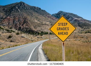 Steep Grades Warning Sign:  A Sign Warns Of A Steep Climb Ahead On A Road Leading Into The Big Horn Mountains Of Northeastern Wyoming.
