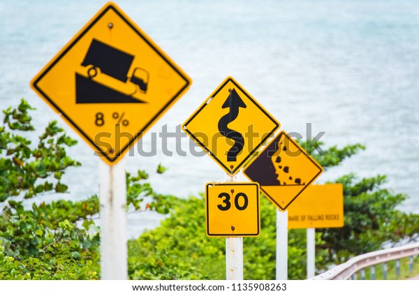 Steep Hill Descent Use Low Gear Traffic Sign on\
the Road in Thailand