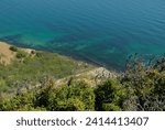 Steep mountainside near the sea with stunning views of turquoise water