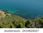 Steep mountainside near the sea with stunning views of turquoise water