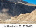 Steep, narrow mountain road with dangerous dropoff on descent from Rizong gompa MonasteryLadakh, India