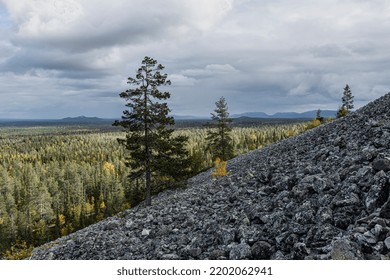 Steep Rocky Montain Slope And Montain Range In The Background