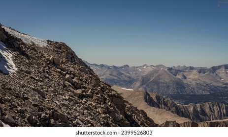 Steep rocky mountain wall to top of White Mountney with view on tops of Sierra Nevada in America, usa at sunny day