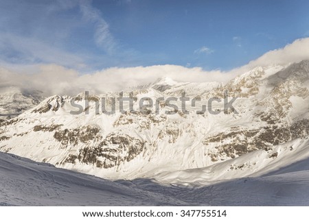 Steep ski slope couloir at winter alpine ski resort