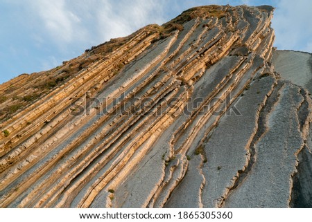 STEEP SOTNE TEXTURE WHEN THE SUNSET NEAR THE BEACH AT ASTURIAS, SAPIN