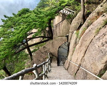 Steep stairs and trail perching on the cliff at Yellow Mountain