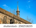 Steeple and roof of the Dominican church in Colmar, Haut-Rhin department, Alsace, France.