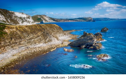 Steeply Dipping Beds Of Portland Limestone At Mupe On Dorset's Jurassic Coast In Southen England. 