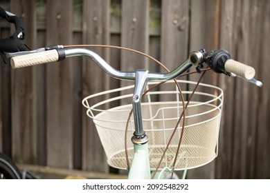 steering handlebars of bicycle with basket attached to it