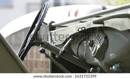 Steering wheel and control panel of a military American World War II pickup truck with manual transmission (first Humvees)