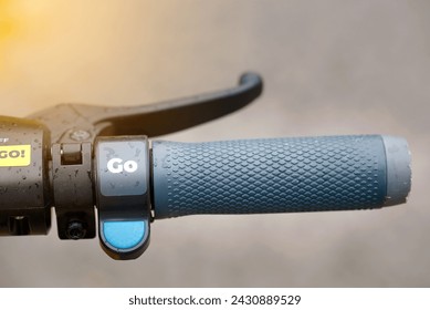 Steering wheel of an electric scooter, closeup. Detail of steering wheel with hand brake. Rubber handlebar grips
 - Powered by Shutterstock