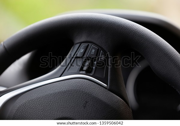 The\
steering wheel of a good modern car with\
navigator.