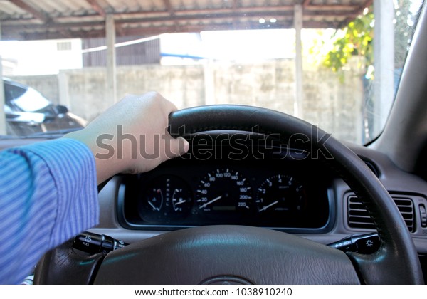  steering wheel and\
hand