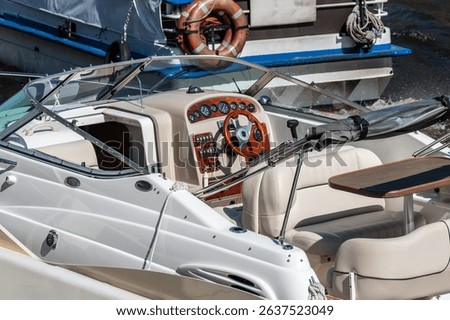 Steering wheel, instrument panel of a comfortable high-speed pleasure boat.