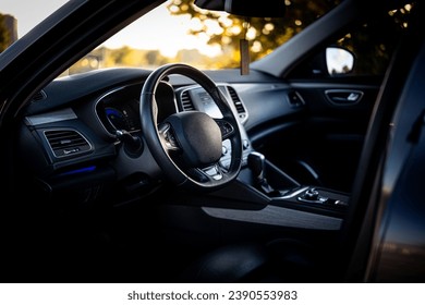  steering wheel, LCD radio, and gear shift lever in a car , Close-up - Powered by Shutterstock