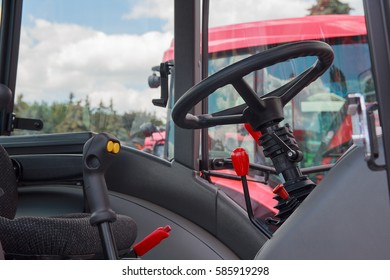 Steering wheel and levers in the cab closeup. Industry - Powered by Shutterstock