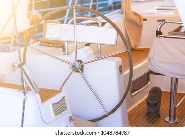 Steering Wheel On Boat With Empty Seats