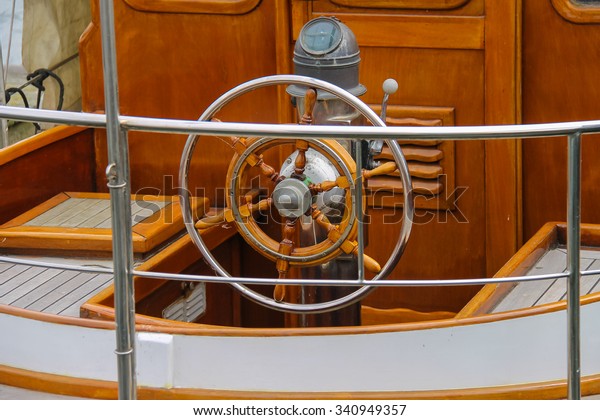 Steering wheel on the deck of
a boat