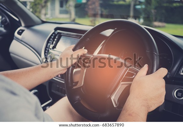steering wheel on hand / \
car driving 