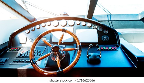 Steering wheel on luxury yacht.