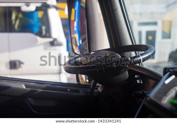 steering\
wheel of truck car for cargo\
transportation
