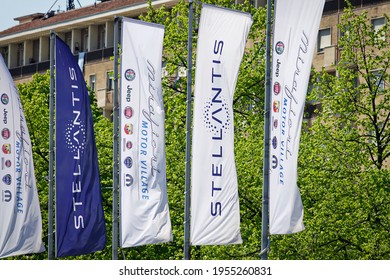 The Stellantis logo and new flags are installed at Mirafiori. Stellantis was created from the merger of the Fiat Chrysler Automobiles and PSA industrial groups. Turin, Italy - April 2021