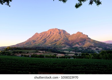 Stellenbosch At Sunset With Nice Orange Colors Over The Mountains