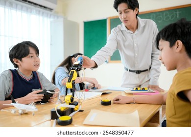 STEM Class, Teacher and students in basic engineering classroom