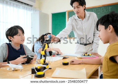 STEM Class, Teacher and students in basic engineering classroom