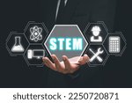 STEM concept, science, technology, engineering, mathematics, Businessman hand holding STEM icon on virtual screen.
