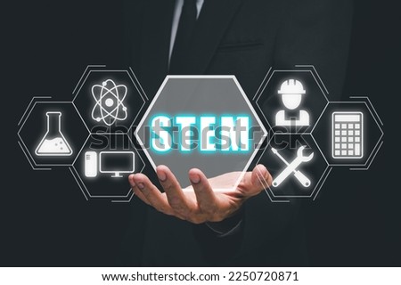 STEM concept, science, technology, engineering, mathematics, Businessman hand holding STEM icon on virtual screen.