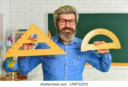 Stem education concept. study algebra at university. back to school. teacher of arithmetic. calculation and search of various data. precision measurement tool. man use protractor and triangle.