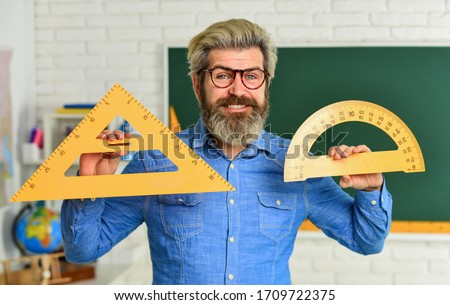 Stem education concept. study algebra at university. back to school. teacher of arithmetic. calculation and search of various data. precision measurement tool. man use protractor and triangle.