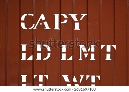 Stencil-Style Typography on Red Surface Boxcar Abstract Background
