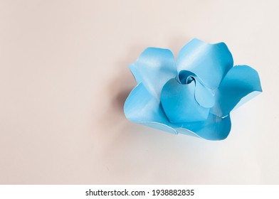 Step 2, Paper 3 D Flower Make Origami Rose And  Handmade  Romantic Bouquet For Valentine, Wedding, Card, And Decorate Backdrop. Focus Blue Rose Paper On The White Background.