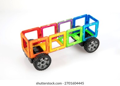 Step 3 Adding Wheels to Magnetic Camper Van Educational Toy
