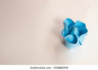 Step 3, Paper 3 D Flower Make Origami Rose And  Handmade  Romantic Bouquet For Valentine, Wedding, Card, And Decorate Backdrop. Focus Blue Rose Paper On The White Background.