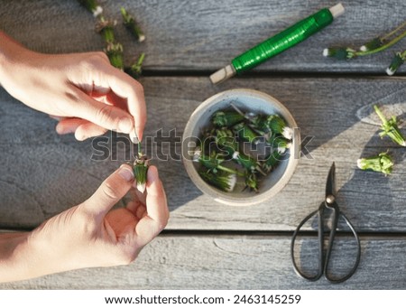 Step 3. Push the metal wire through the bottom of the buds. Make a summer garland decor in heart shape. Creative crafts with natural material