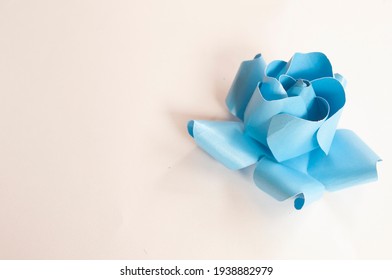 Step 4, Paper 3 D Flower Make Origami Rose And  Handmade  Romantic Bouquet For Valentine, Wedding, Card, And Decorate Backdrop. Focus Blue Rose Paper On The White Background.