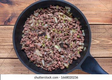 Step By Step Cooking Chili Con Carne, Step 4 - Roast Sliced Beef, Top View, Horizontal