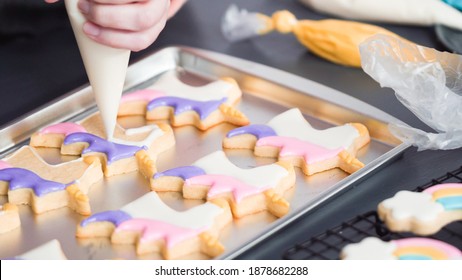 Step By Step. Decorating Unicorn Sugar Cookies With Royal Icing On Baking Sheet.