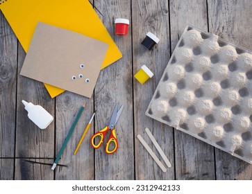 Step by step diy process. Step 2- we draw a honey be figurine on the egg box. Creativity, crafting. Zero waste concept.