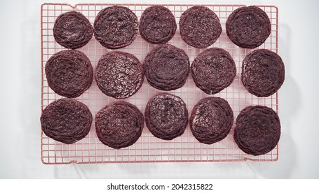 Step by step. Flat lay. Cooling freshly baked chocolate cookies on a wire rack.