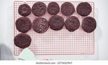 Step by step. Flat lay. Cooling freshly baked chocolate cookies on a wire rack.