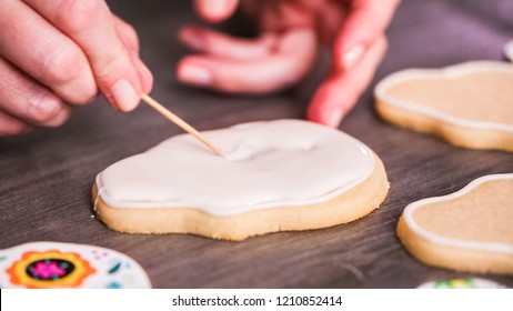 Step By Step. Flooding A Sugar Skull Cookie With White Royal Icing.