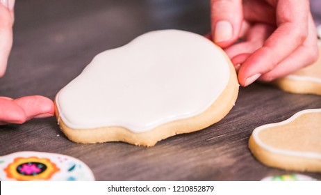 Step By Step. Flooding A Sugar Skull Cookie With White Royal Icing.