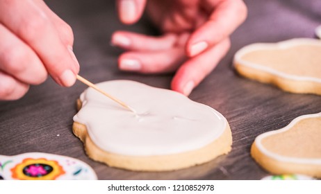 Step By Step. Flooding A Sugar Skull Cookie With White Royal Icing.