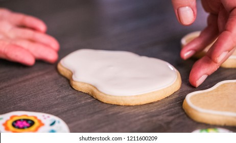 Step By Step. Flooding A Sugar Skull Cookie With White Royal Icing.